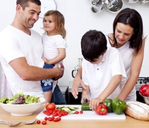 children_cooking_vegetables_with_parents